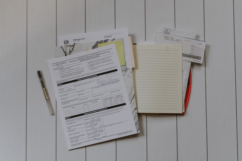 Person reviewing a tax return on a desk