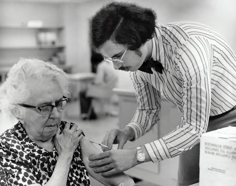 Older patient receiving a vaccine